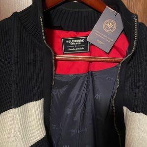 Holebrook dark blue sweater. White stripe across chest. Brand new